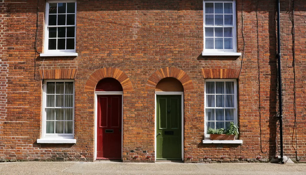a set of doors in different colours symbolising the different choices of real estate agents